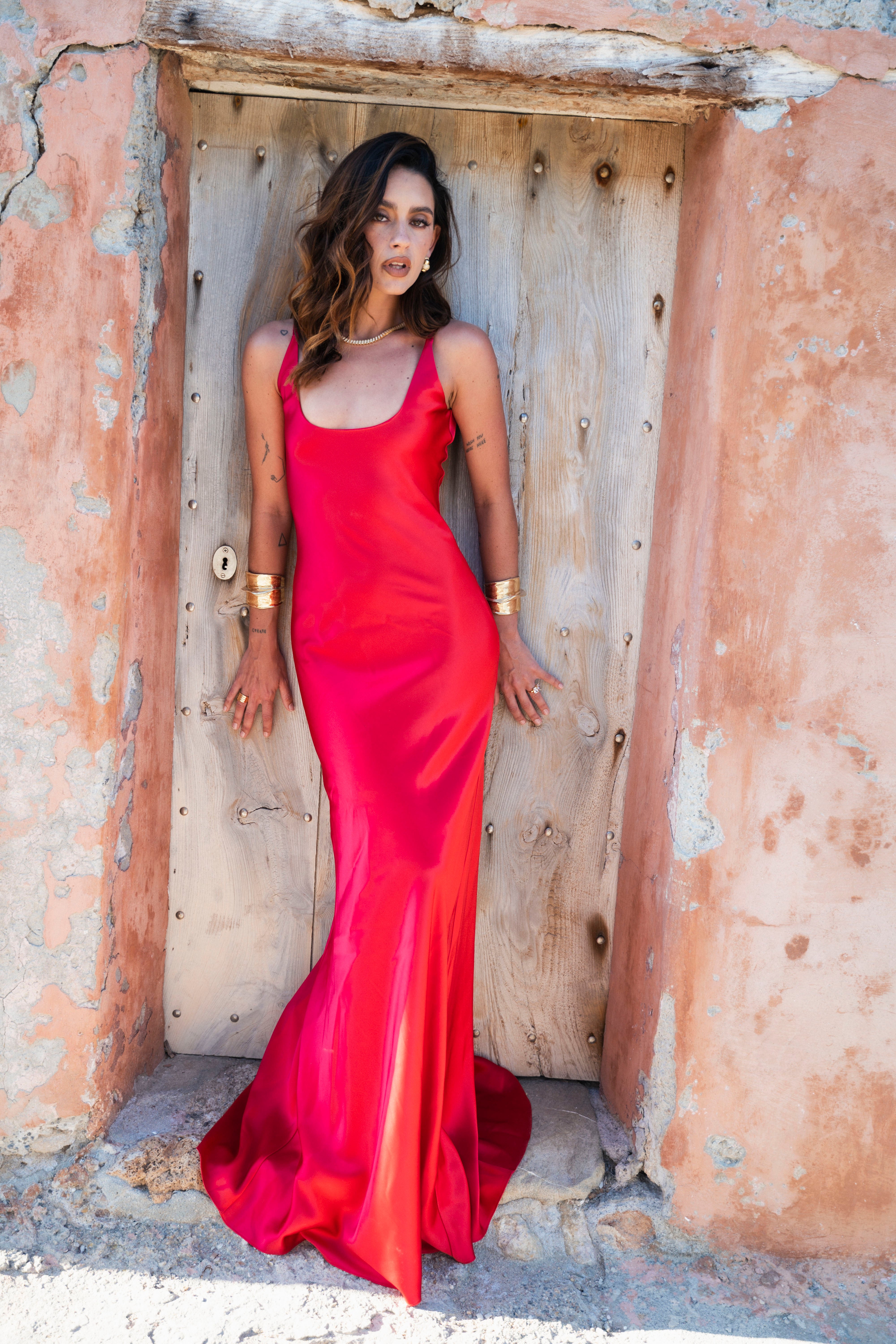 cherry red satin dress Hand-draped in luminous cherry red silk, our one-shoulder gown is meticulously crafted for both fluidity and drama. Designed to command a room and capture the heart